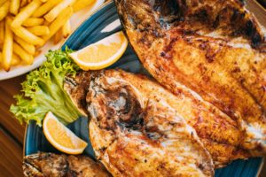 Dish with Gilt-head bream Fish With orange and french fries. Dorada, Dorade, dorado,